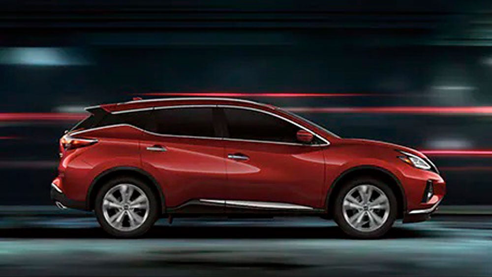 2023 Nissan Murano shown in profile driving down a street at night illustrating performance. | Empire Nissan of Bay Ridge in Brooklyn NY