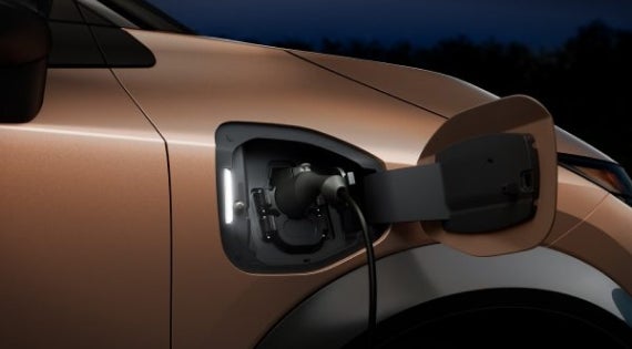 Close-up image of charging cable plugged in | Empire Nissan of Bay Ridge in Brooklyn NY